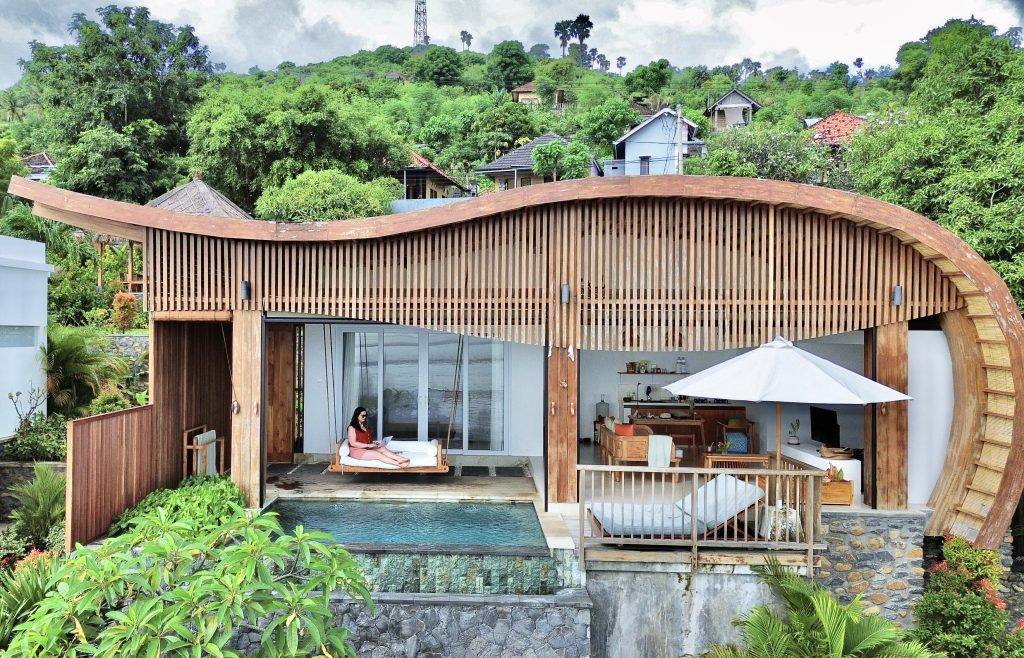 A featured image showing a modern hillside villa with a pool and a woman working on a laptop. The full blog title, "Is Your Business Travel-Ready? 5 Signs It Is (and 3 That Say Not Yet)," is overlaid, along with side panels listing specific business readiness checks.