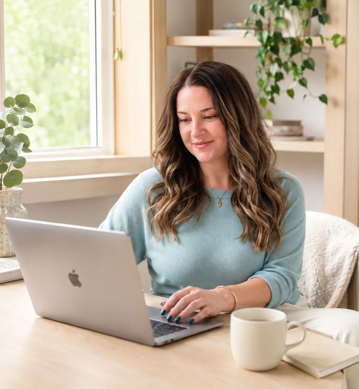 Marybeth Welty working at her laptop in her home office in Vancouver